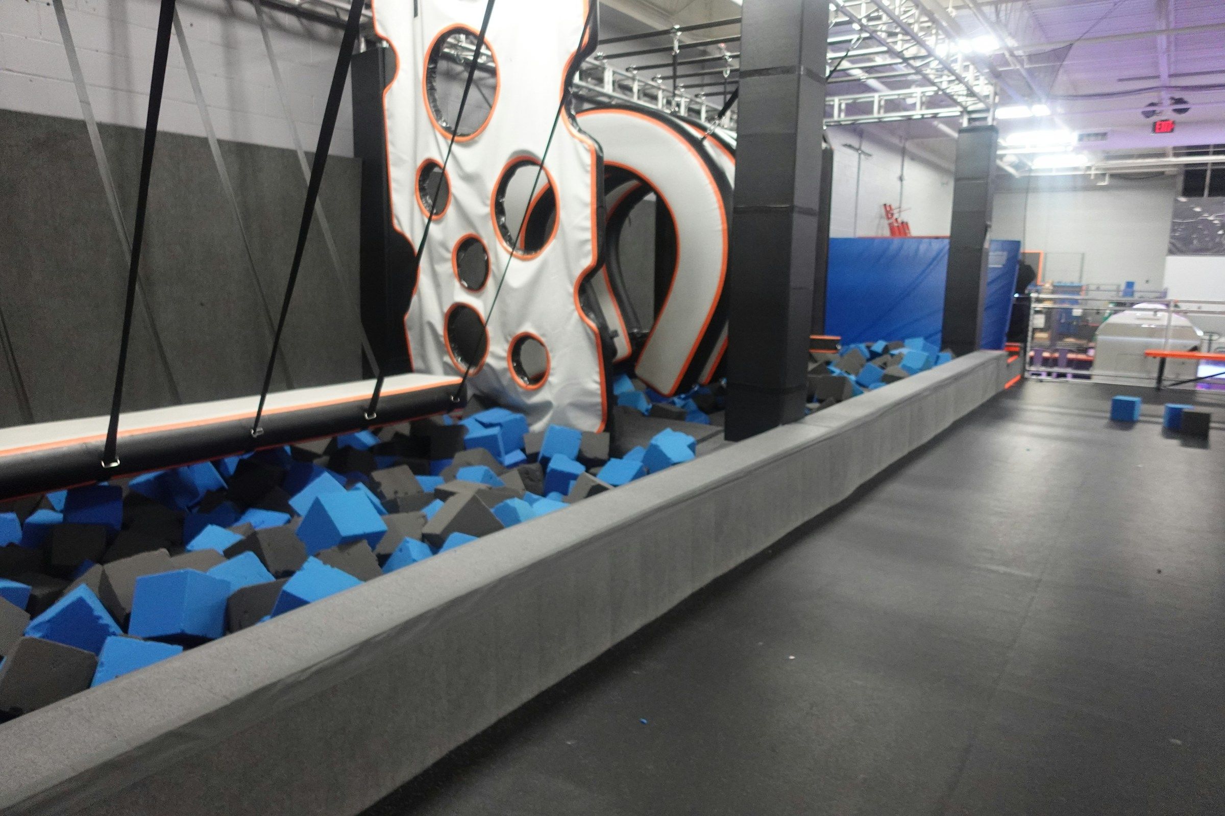 Person mid-jump at the Apex trampoline park